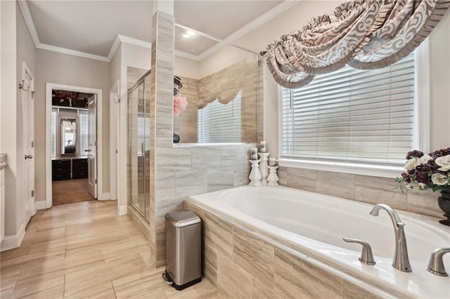 244 Lotus Cir, Mcdonough, GA 30252 - bathroom with a bath, a shower stall, crown molding, and baseboards