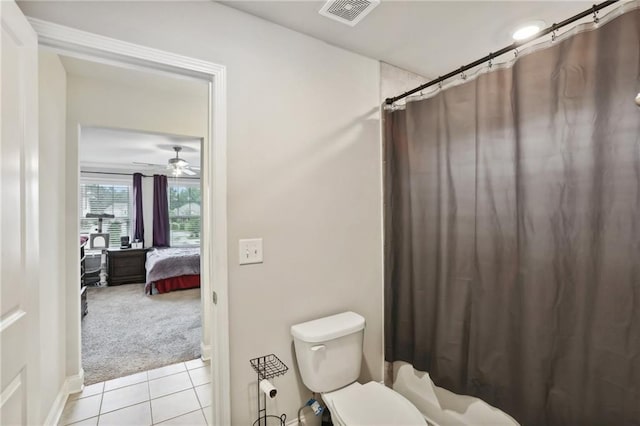 244 Lotus Cir, Mcdonough, GA 30252 - full bath with a shower with shower curtain, visible vents, ceiling fan, tile patterned floors, and toilet
