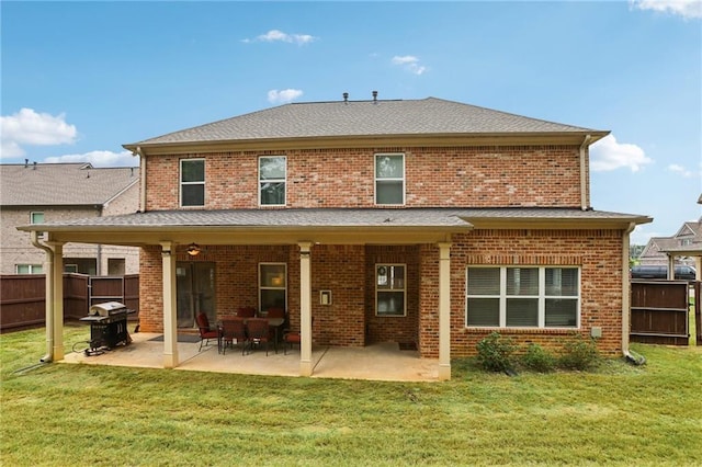 244 Lotus Cir, Mcdonough, GA 30252 - rear view of property featuring a lawn, a patio, and fence