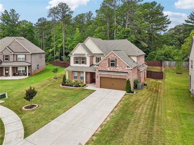 244 Lotus Cir, Mcdonough, GA 30252 - view of front of house with brick siding, board and batten siding, fence, a front yard, and central AC