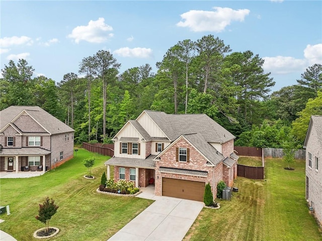 244 Lotus Cir, Mcdonough, GA 30252 - view of front facade with central air condition unit, board and batten siding, concrete driveway, and fence