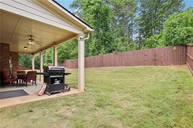 244 Lotus Cir, Mcdonough, GA 30252 - view of yard featuring ceiling fan, a patio, and a fenced backyard