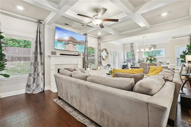 244 Lotus Cir, Mcdonough, GA 30252 - living area featuring dark wood finished floors, beam ceiling, a fireplace, and visible vents