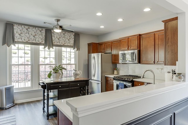 kitchen featuring light countertops, plenty of natural light, and stainless steel appliances
