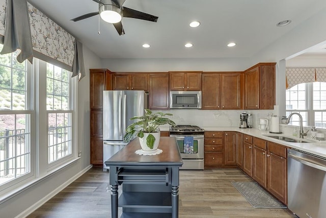 kitchen featuring a wealth of natural light, appliances with stainless steel finishes, and a sink