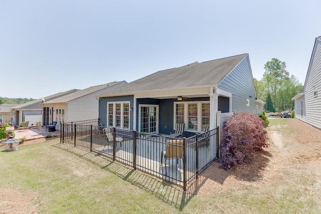 rear view of house featuring ceiling fan, fence, and a patio area