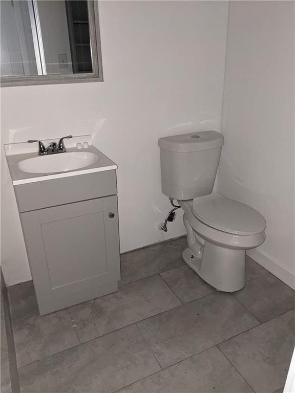 half bath with toilet and vanity