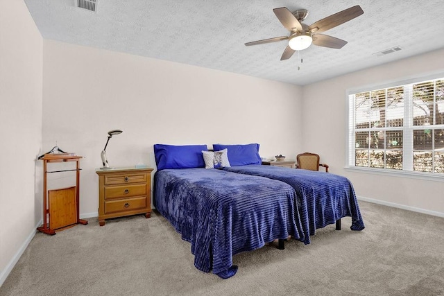 bedroom featuring light colored carpet, visible vents, and baseboards