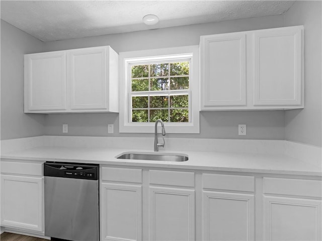 220 Sugar Hill Ct, Jackson, GA 30233 - kitchen with dishwasher, a sink, light countertops, white cabinetry, and a textured ceiling
