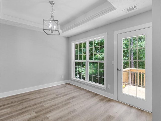 220 Sugar Hill Ct, Jackson, GA 30233 - unfurnished dining area featuring a chandelier, light wood finished floors, healthy amount of natural light, baseboards, and crown molding