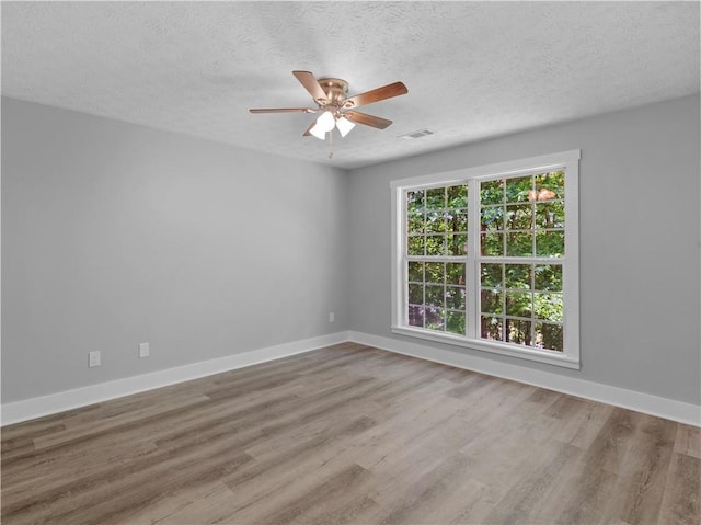 220 Sugar Hill Ct, Jackson, GA 30233 - spare room with ceiling fan, wood finished floors, baseboards, and a textured ceiling