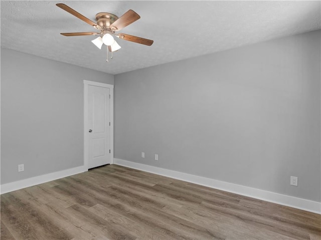 220 Sugar Hill Ct, Jackson, GA 30233 - empty room with ceiling fan, baseboards, and wood finished floors