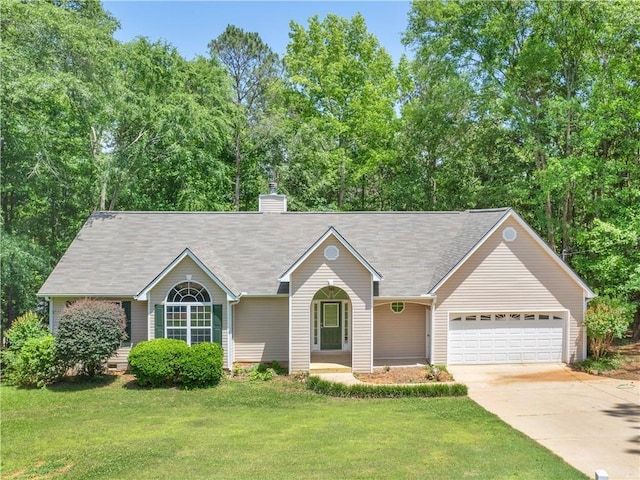 220 Sugar Hill Ct, Jackson, GA 30233 - ranch-style home featuring driveway, an attached garage, a front yard, and a chimney