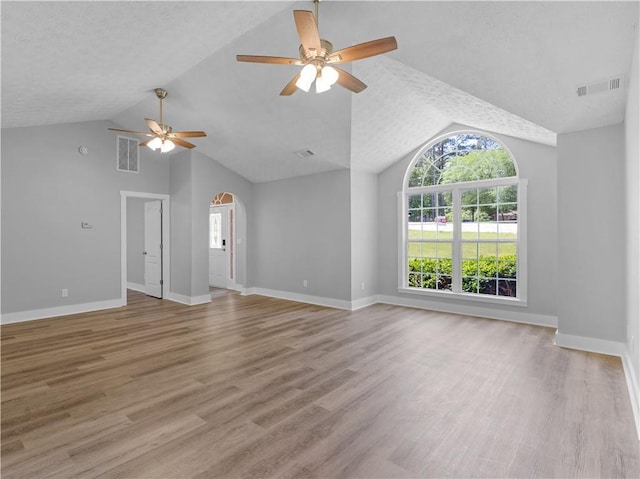 220 Sugar Hill Ct, Jackson, GA 30233 - unfurnished living room with lofted ceiling, ceiling fan, plenty of natural light, and light wood-style flooring