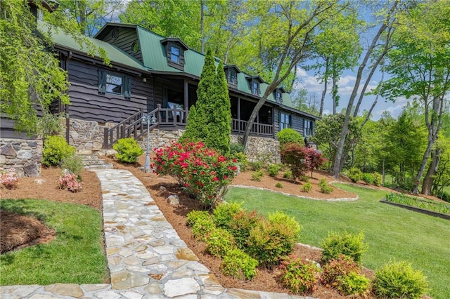 259 Eagle Chase Cir, Dillard, GA 30537 - back of property featuring a lawn, a metal roof, covered porch, and stone siding