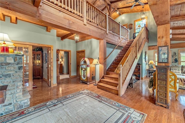 259 Eagle Chase Cir, Dillard, GA 30537 - stairs featuring a wood ceiling with exposed beams, wood finished floors, and high vaulted ceiling