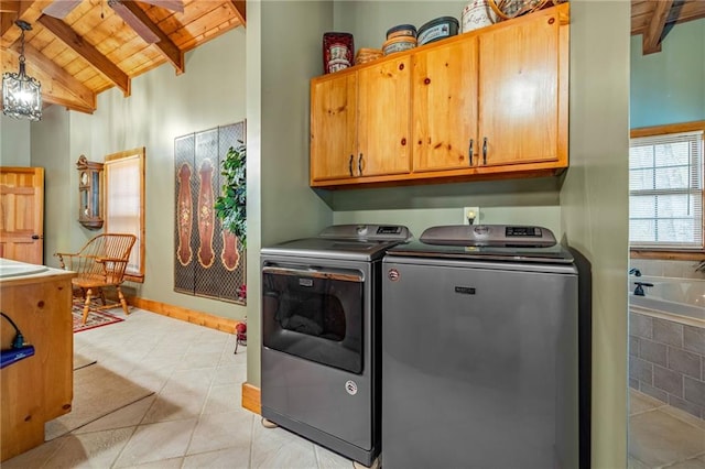 259 Eagle Chase Cir, Dillard, GA 30537 - laundry area featuring wood ceiling, washer and clothes dryer, cabinet space, and light tile patterned floors