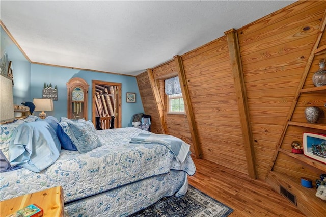 259 Eagle Chase Cir, Dillard, GA 30537 - bedroom featuring wood finished floors and a textured ceiling