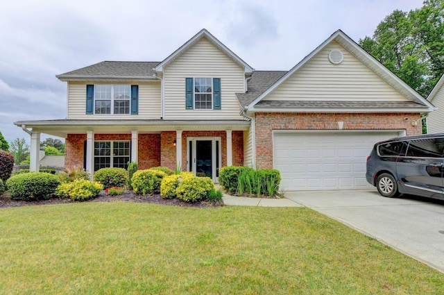 view of front of house with a porch, a garage, and a front lawn