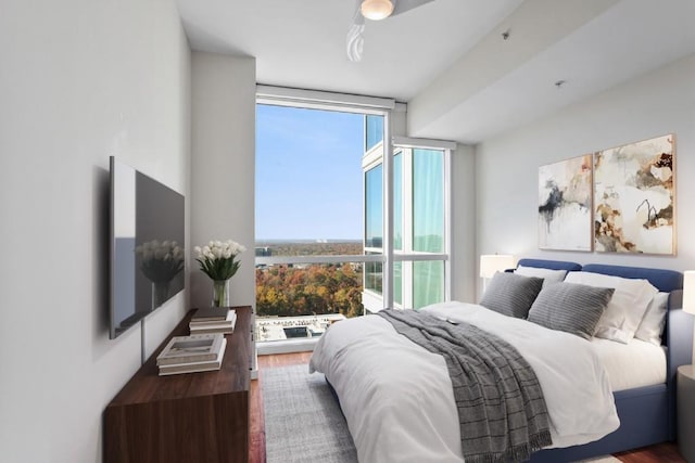 3325 Piedmont Rd NE Unit 2104, Atlanta, GA 30305 - bedroom featuring floor to ceiling windows and wood finished floors