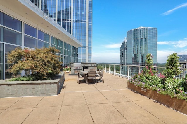 3325 Piedmont Rd NE Unit 2104, Atlanta, GA 30305 - view of patio / terrace featuring outdoor dining area and grilling area
