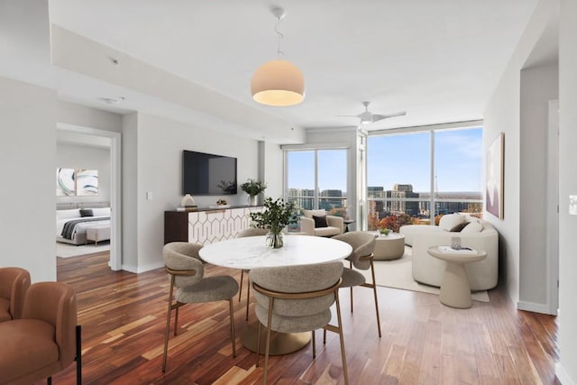 3325 Piedmont Rd NE Unit 2104, Atlanta, GA 30305 - dining space with wood finished floors, ceiling fan, and baseboards
