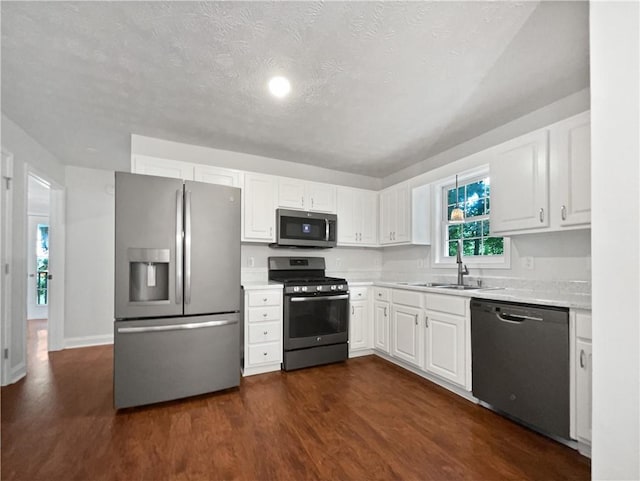 643 Windy Mill Way, Temple, GA 30179 - kitchen with stainless steel appliances, light countertops, white cabinets, and a textured ceiling