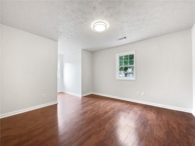 643 Windy Mill Way, Temple, GA 30179 - empty room featuring dark wood finished floors and a textured ceiling