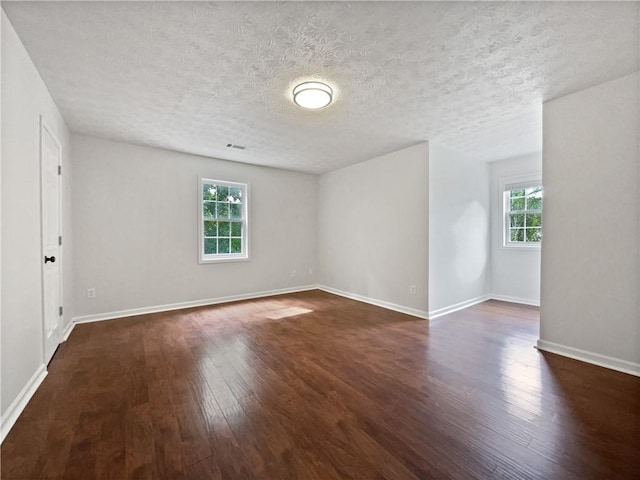 643 Windy Mill Way, Temple, GA 30179 - unfurnished room featuring dark wood-style flooring and a textured ceiling
