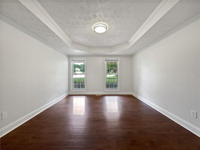 643 Windy Mill Way, Temple, GA 30179 - unfurnished room with a raised ceiling, dark wood-type flooring, a textured ceiling, and crown molding