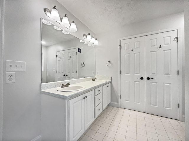 643 Windy Mill Way, Temple, GA 30179 - full bath with double vanity, tile patterned flooring, and a closet