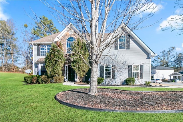 view of property with a front lawn