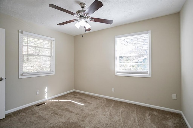 unfurnished room with carpet floors and ceiling fan