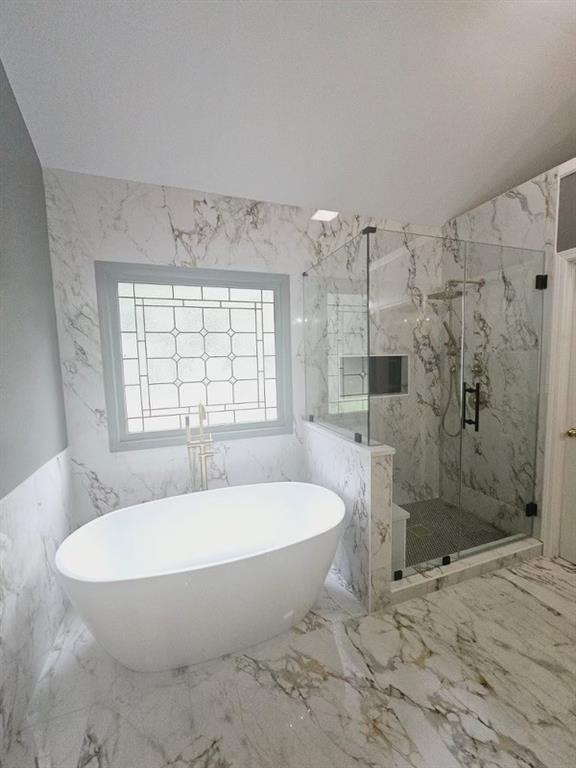434 Beachwood Dr, Cornelia, GA 30531 - full bathroom featuring a marble finish shower, a freestanding tub, marble tiled flooring, and tile walls
