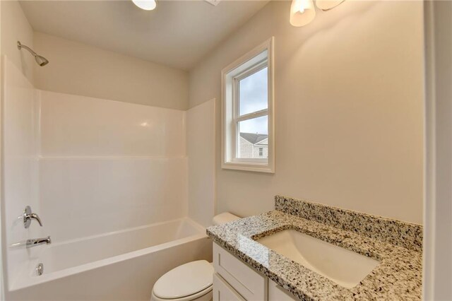 full bathroom with vanity, shower / tub combination, and toilet