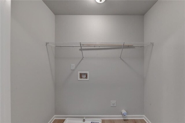 laundry area featuring hookup for an electric dryer, wood-type flooring, and washer hookup