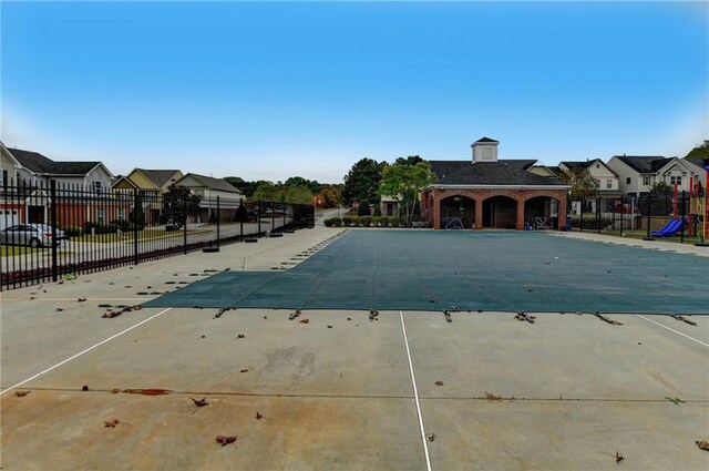 view of swimming pool featuring a playground