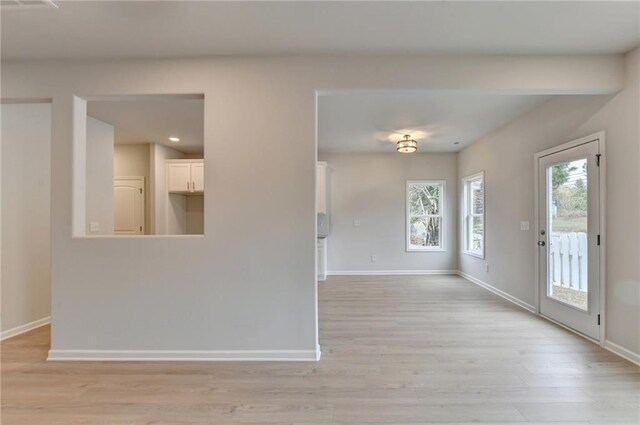 unfurnished room featuring light wood-type flooring