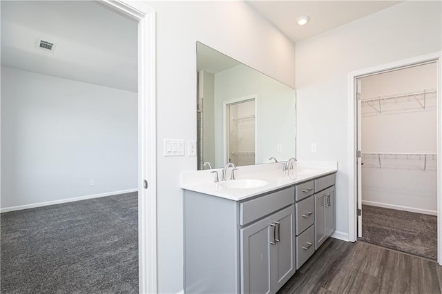 bathroom featuring vanity and wood-type flooring