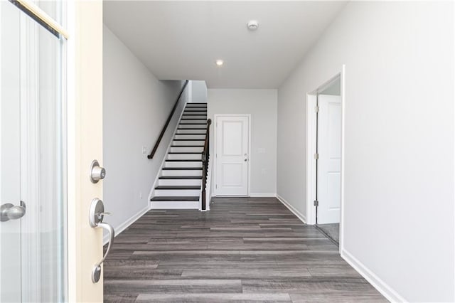 staircase featuring hardwood / wood-style flooring