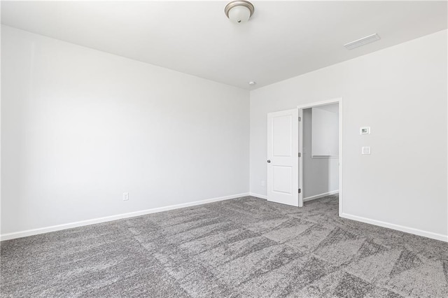 spare room with carpet floors