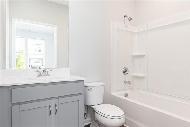 full bathroom featuring vanity,  shower combination, and toilet