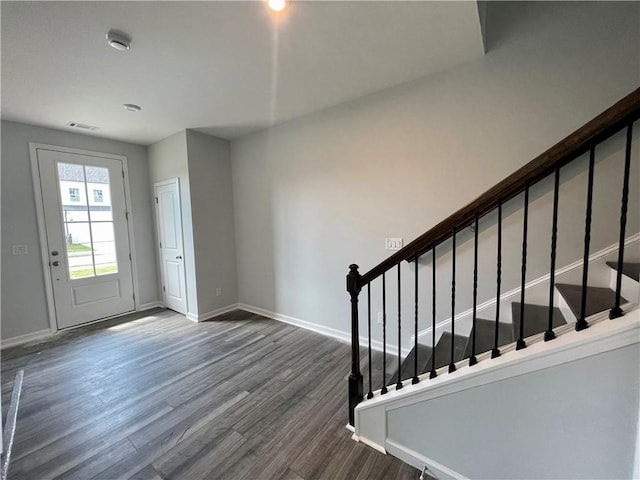 entryway featuring dark wood-type flooring