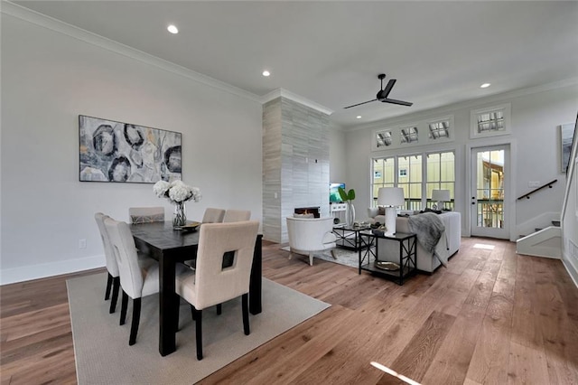 dining space featuring ceiling fan, crown molding, and wood-type flooring