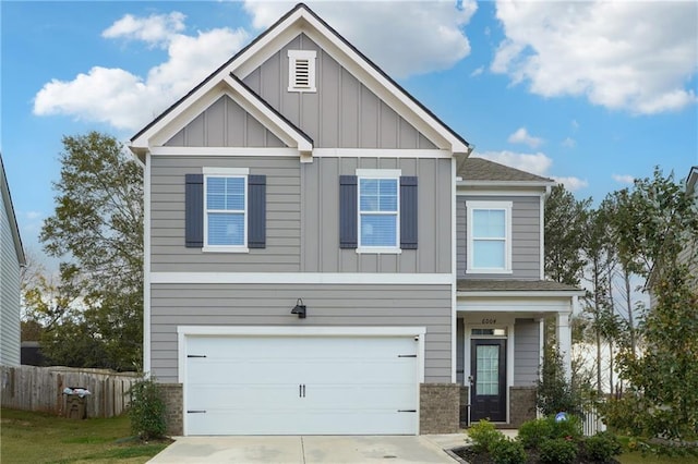 6004 Screech Owl Dr, Flowery Branch, GA 30542 - craftsman inspired home featuring board and batten siding, an attached garage, driveway, and brick siding