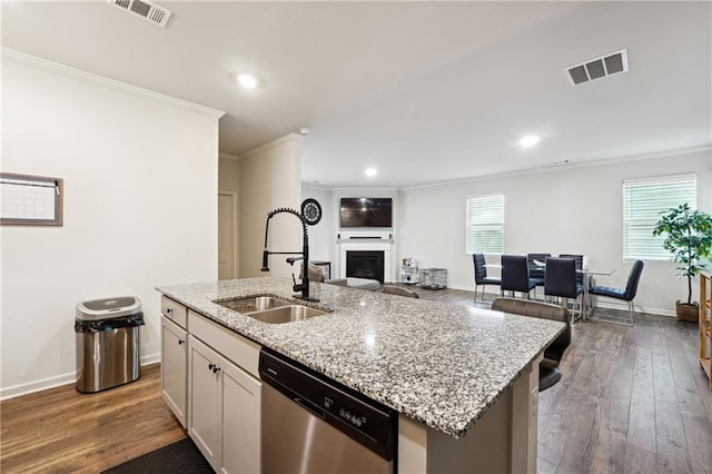 6004 Screech Owl Dr, Flowery Branch, GA 30542 - kitchen featuring dishwasher, a sink, crown molding, a fireplace, and dark wood-style flooring