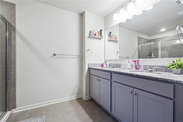 6004 Screech Owl Dr, Flowery Branch, GA 30542 - bathroom featuring a shower stall, double vanity, tile patterned floors, and baseboards
