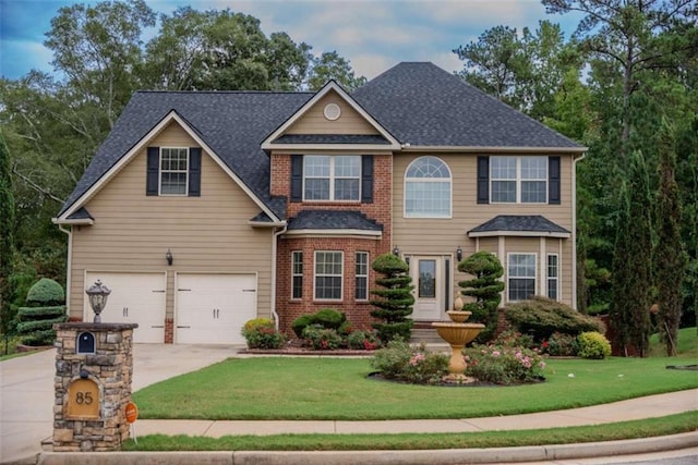 view of front facade featuring a garage and a front lawn