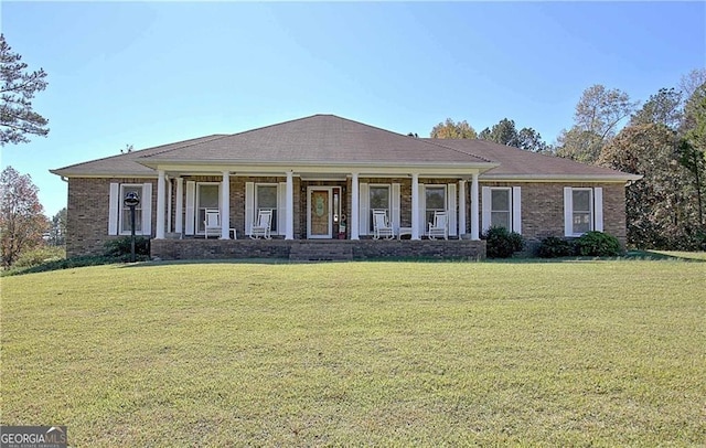 19 Quimby Jackson Rd, Newnan, GA 30263 - view of front of house featuring covered porch, a front yard, and brick siding