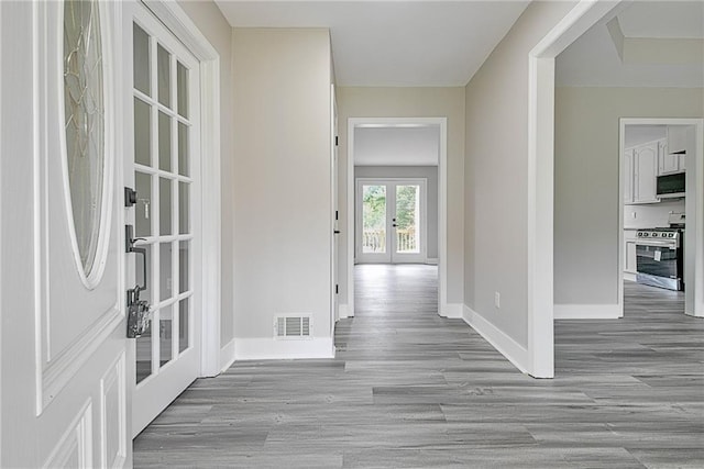 19 Quimby Jackson Rd, Newnan, GA 30263 - hall featuring french doors and wood finished floors